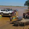 Madagascar-crossing-river-four-wheel-drives-via-barge