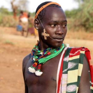 Hamar tribesman wearing ornate beads around his neck