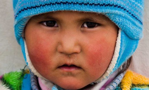 Kyrgyzstan-Young-Kyrgyz-boy-in-yurt-camp-taken-by-Stephen-Cruise
