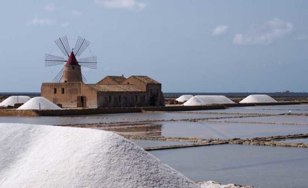 Salt pans drying in the sun and mounds of salt