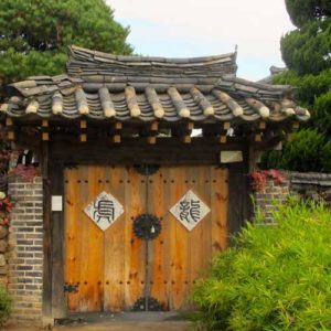 Timber gate entrance to walled property