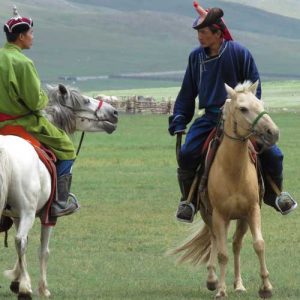 Mongolian men on horseback at Naadam